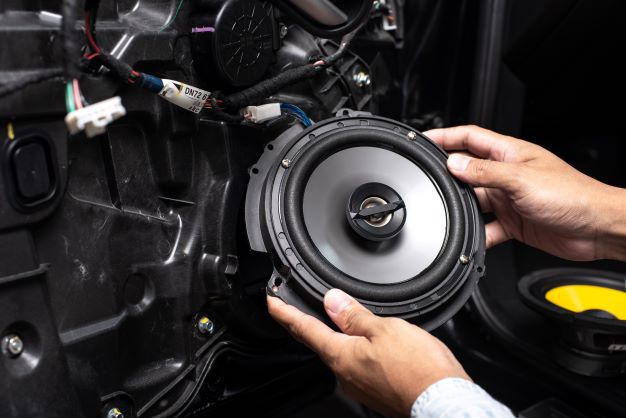a car's sound system being modified